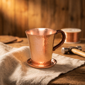 Taza y platillo de cobre